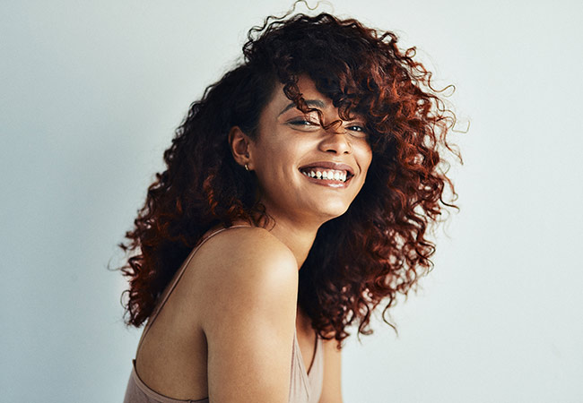 smiling woman after prp microneedling tysons corner & Fairfax
